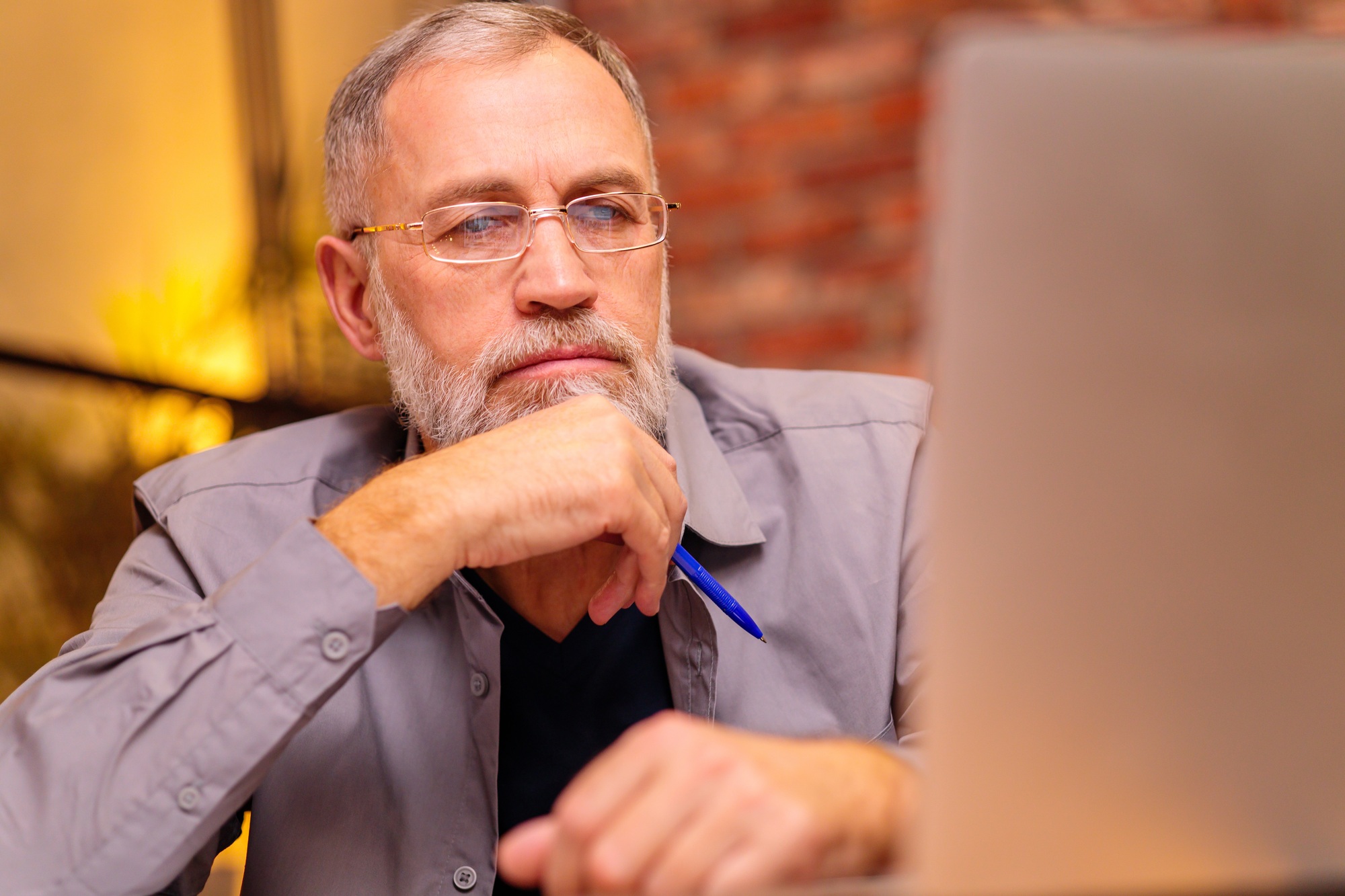 a man looking at a laptop